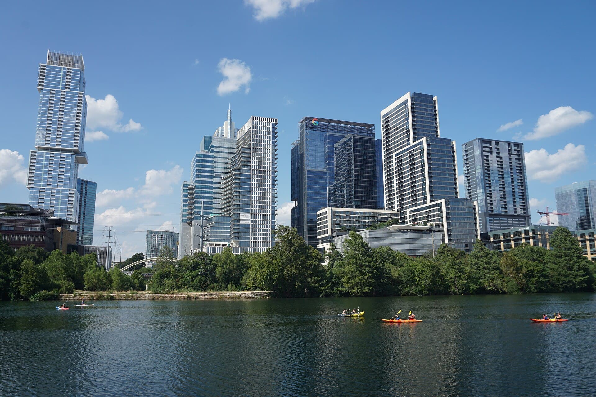 Downtown Austin skyline over Lady Bird Lake with kayakers on the water