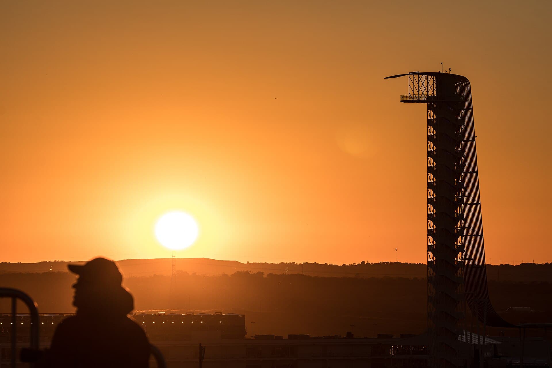 Sunset behind the Circuit of the Americas observation tower in Austin, Texas